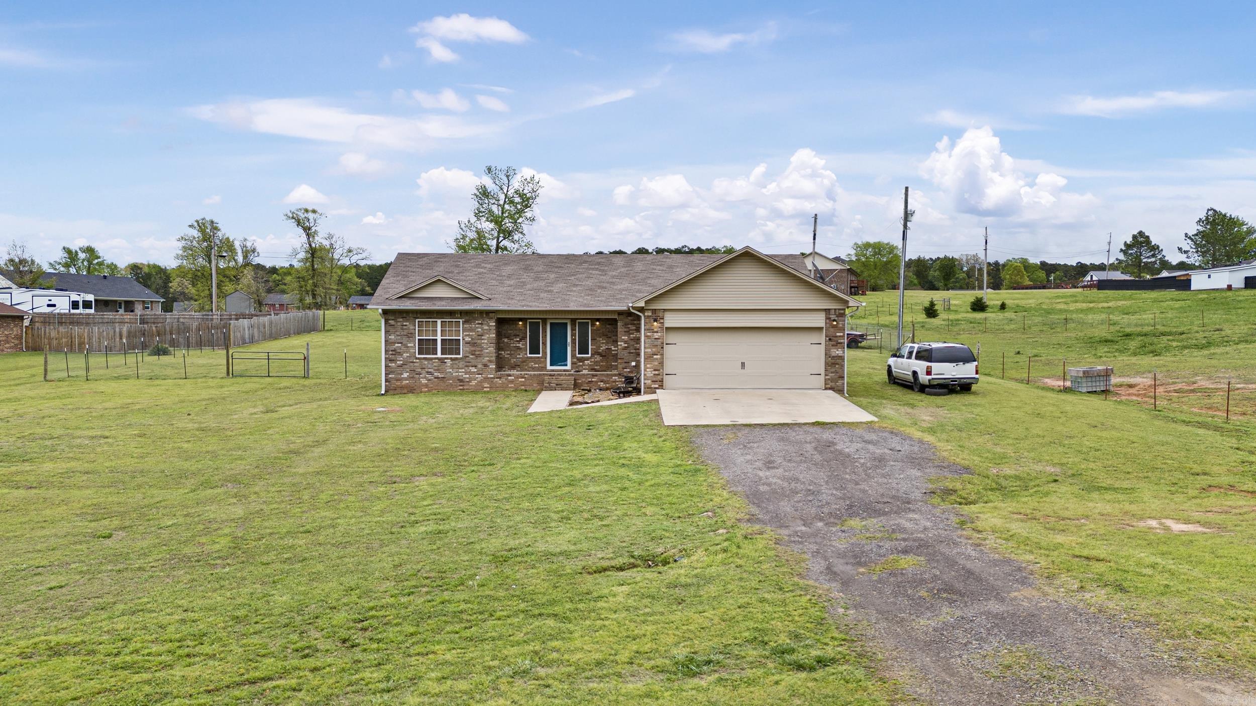 Located on a spacious 1-acre lot, this 3 bedroom, 2 bathroom home offers the perfect blend of comfort, privacy, and convenience. With a split floor plan, the master suite is separated from the two additional bedrooms, providing a sense of privacy and tranquility for the homeowner. The generously sized lot provides ample room for some animals, making it ideal for those who desire a rural lifestyle without sacrificing modern amenities. Whether you have horses, chickens, or goats, there is plenty of space for them to roam and thrive. This home is perfect for those looking to escape the hustle and bustle of city life and enjoy the serenity of rural living.