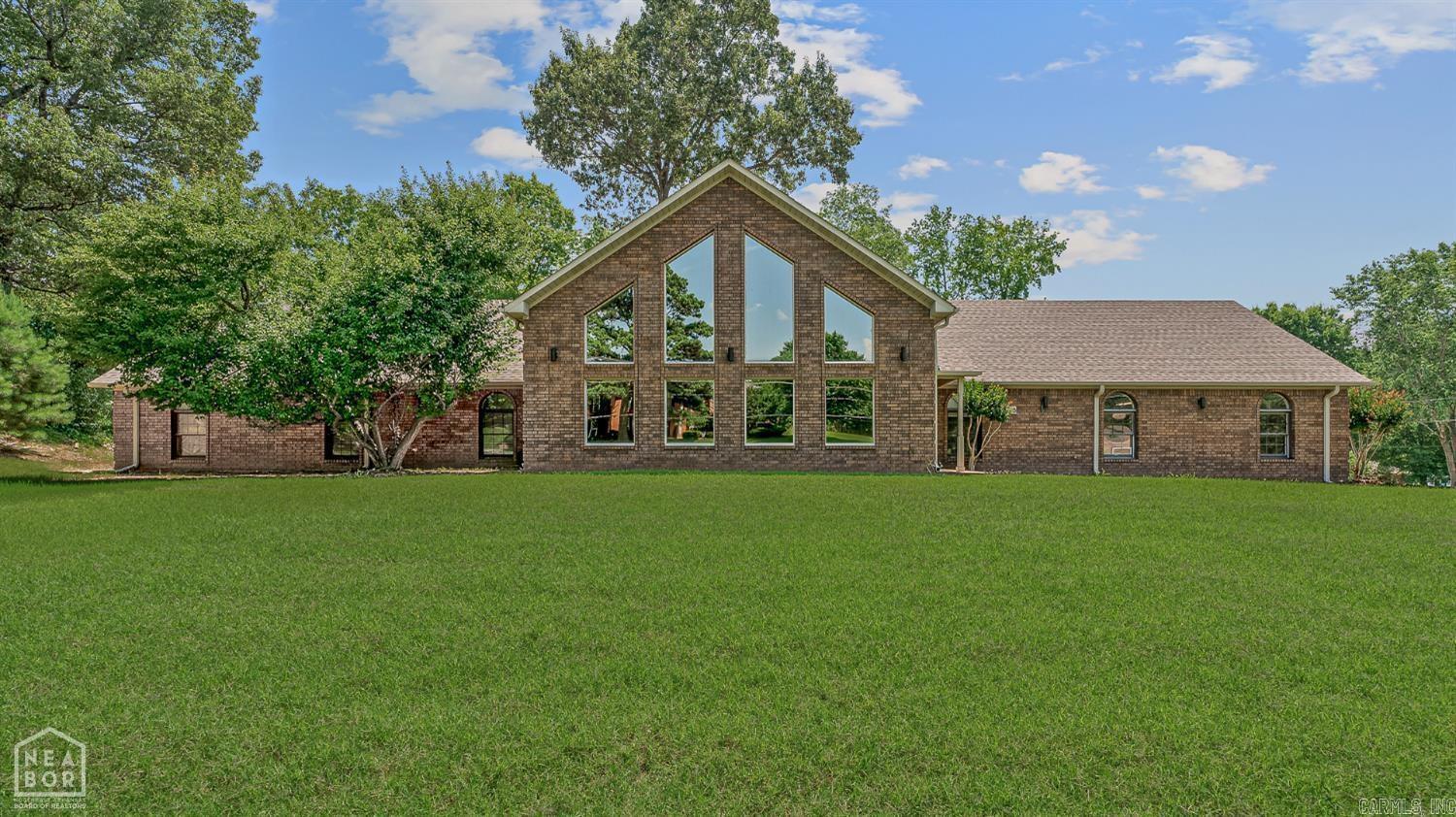 Welcome to 5510 Crowleys Ridge Rd in Valley View School District! This spacious 3,824± sq ft home sits on .97± acres and features 3 large bedrooms, 3 full bathrooms, an attached 2-car garage, and a 40x30 shop with two garage doors and its own driveway. Inside, enjoy a stunning two-story fireplace, vaulted ceiling, and floor-to-ceiling windows overlooking the front yard. The updated kitchen boasts granite counters, glass tile backsplash, double oven, top-tier appliances, and a walk-in pantry. The primary suite includes an updated bath with a double vanity, walk-in shower, handicap tub, and large walk-in closet. Two bedrooms feature en-suite baths. Additional updates include 2021 roof, newer HVACs (all under 5 years), smart light switches in den, 3-zone smart thermostat, updated bathrooms (2017), and a cast iron tub. Handicap-accessible doors and wide hallway on main level. Donāt miss the refinished deck and fully upgraded features throughout!
