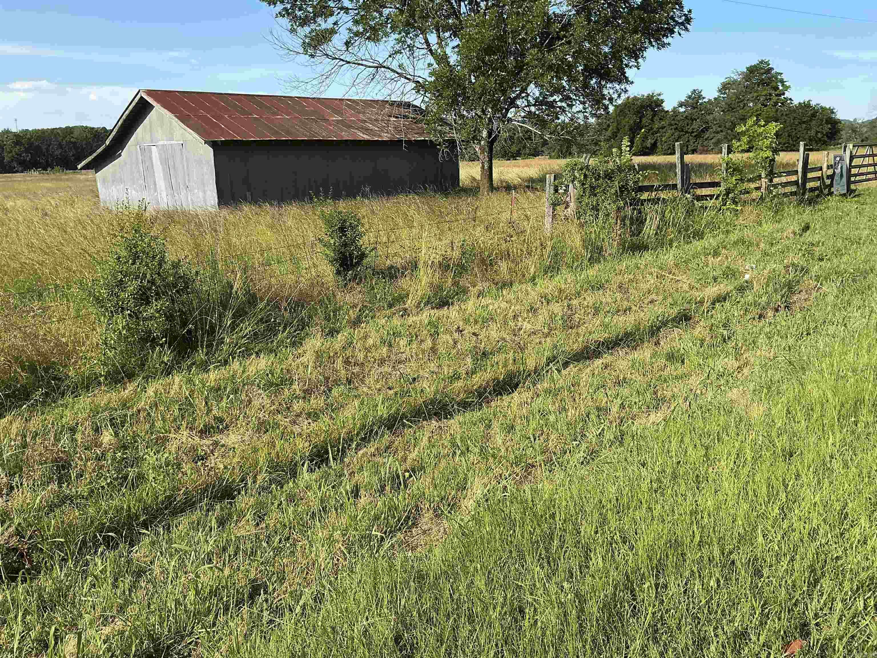 66 (+-) Acres Hwy 800 ft of Hwy Frontage (+-) Pasture Land Fenced Cross Fenced With Over 1500 ft of South Fork River Frontage to swim Fish what ever you want to do. Land is Nearly level with unlimited options for Home Farm Recreational or camping, has a hay or storage building.