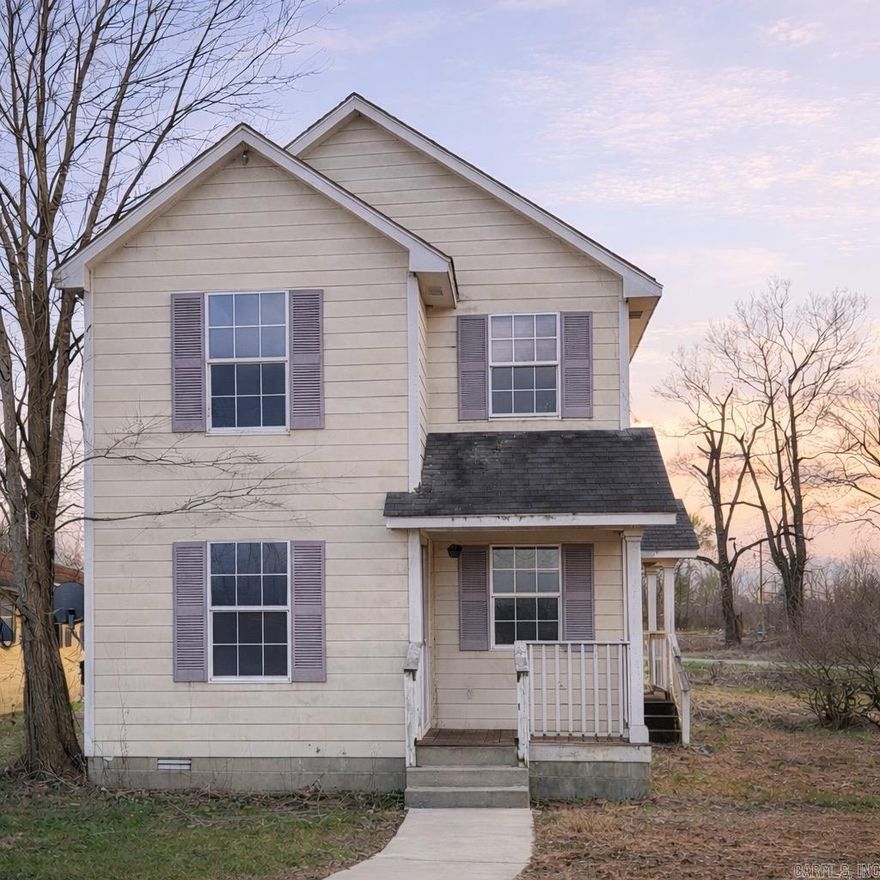 Need another rental? Or bring your toolbox and creative vision and make it your own!  "This cozy 3 BD/1.5 BA two story fun house is full of charm and potential - and it waits for you to refresh it! Conveniently located on the west outskirts of town, walking distance to Walmart, Hays and local fast food, it makes every day errands and meals a breeze. Unique triangular lot with large yard and room for extras.  Whether you're an investor adding to your portfolio or a handy future homeowner, this property is a great opportunity at an affordable price point.  Selling AS IS"