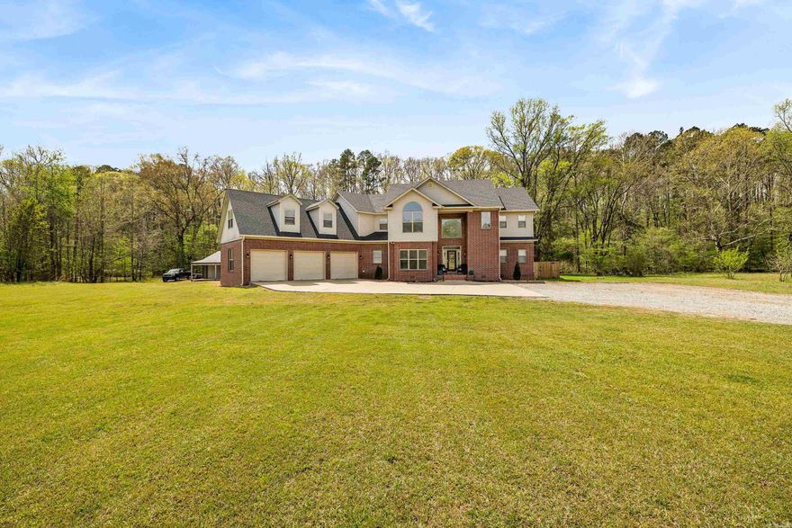 Welcome to your private retreat! Nestled on 6.5 acres along Hwy 298 just outside Benton, this stunning 5,000 SF home offers the perfect blend of space, comfort, and peaceful country living. Four bedrooms, a bonus room, office, and dedicated media room provide flexibility for both everyday living and entertaining. Step outside and enjoy the natural beauty of the property, where the land gently backs up to a serene creek, creating a private, park-like setting. The acreage provides room to roam while still being conveniently located just minutes from Benton and I-30 access. A detached, conditioned shop adds even more functionality, ideal for hobbies, extra storage, or workspace needs. Recent updates include the roof (<5 years), HVAC (<2 years), and water heater (2025). Whether you're looking for space to entertain, room to grow, or simply a quiet place to unwind, this property delivers a rare combination of size, functionality, and natural beauty. If you've been searching for a property that truly has it all, this is it!