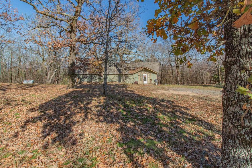 Seller will provide the previous Buyer's inspection report. The Seller made some corrections but is disclosing the home is now being Sold AS IS. The previous Buyer had an FHA loan and the home appraised for $170,000. Located on 5 acres the home sits at the top of Saltillo Heights just past the water tower. The home has Vilonia city water. Property has 10 x 20 shop.  You'll also love the wood burning stove in the living room and the french doors opening onto the deck. All bedrooms are very large and you could easily have room for two beds if needed in each bedroom. The roof and the HVAC were just replaced in August 2022.  Refrigerator to convey. The winter view is for miles and if you removed a few trees you could enjoy the same spectacular view year round. See Agent Remarks.