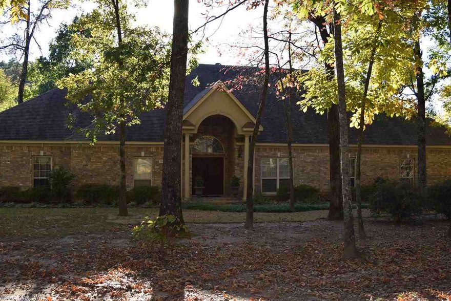 Beautiful custom built 1 level brick home on level 1.09 acre lot. 4 car garage. Split BR plan w/ 2 BRs each end of home, large mstr suit. 4 full baths. 10' ceiling in great rm & foyer-open plan. Gourmet kitchen w/ granite counters, ss appliances, tile backsplash, under cabinet lighting, roll out shelves. Large formal DR, 20'X25' great rm w/ WBFP, fluted trim, 6' crn mold, porcelain tile, hardwoods. Game rm w/ wet bar leads to 43'X11 covered patio. Canned lighting, wood blinds, 50 gal hot water htr. Stunning