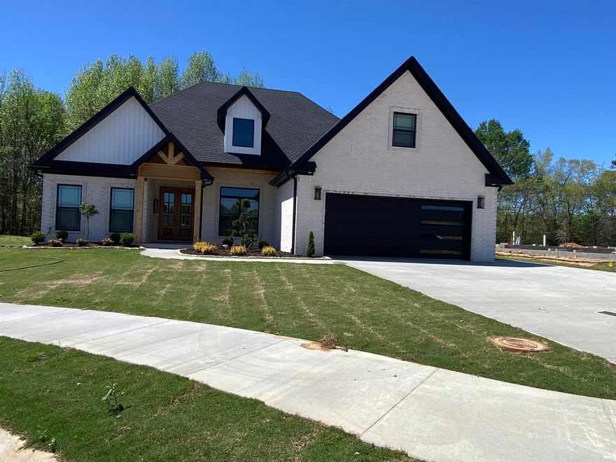 This beautiful home is located in the Brookland School District and is serviced by City Water and Light.  The gorgeous open floor plan is 4 bedroom, 2 bath  the house boasts 12ft raised ceilings. The exterior is covered with all brick and multiple windows surrounding the breakfast area allowing for plenty of natural light. Tray ceilings are found in the master bedroom, the master bath features double sinks, free standing soaker tub, a custom tile shower with a glass shower door. Hardwood flooring is found in the great room and hallway, tile in the laundry room, kitchen, and bathrooms. Carpeting can be found in all bedrooms and the bonus room. Additional features include crown molding, ceiling fans, prefinished wood shelving units, granite countertops in the kitchen and bathroom, tile backsplash lighting in the kitchen, an electric fireplace, a tankless hot water heater and foam insulation.