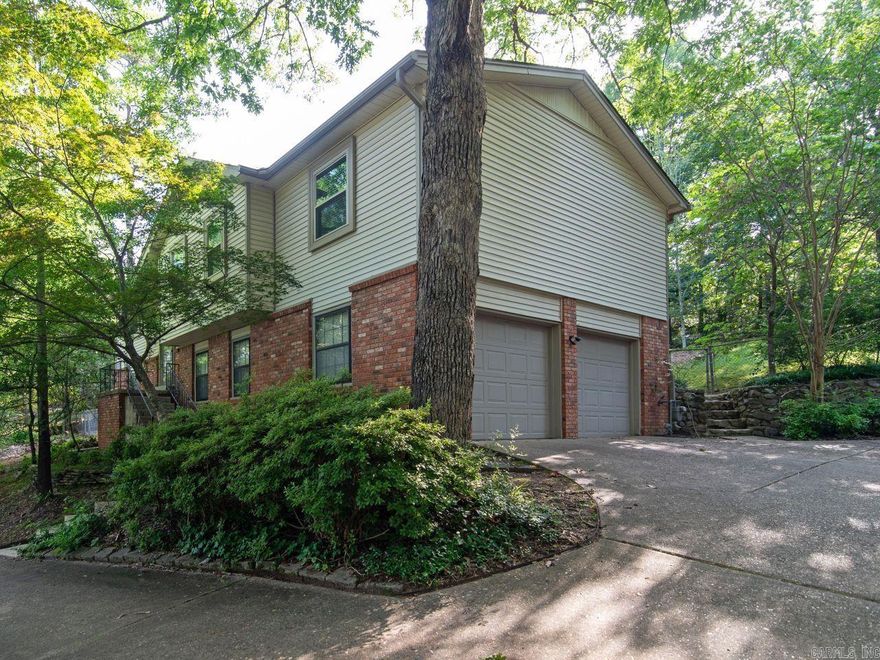 Located on a Large Private Lot in Leawood Manor this Updated Home features Living Room, Large Kitchen/Dining Combination with Stainless Steel Appliances and Breakfast Bar, 3 Large Bedrooms, 2 Full Baths & an Incredible Screened in Deck on the Upper Level! Large Den with Gas Log Fireplace, Wet Bar & Beamed Ceiling, 1 Bedroom, 1 Full Bath, Laundry Room & Huge side Loading Double Garage on the Lower Level! Plus Leaf Guard Gutter System! This is a Wonderful Family Home in one of the nicest Neighborhoods in West L.R!!