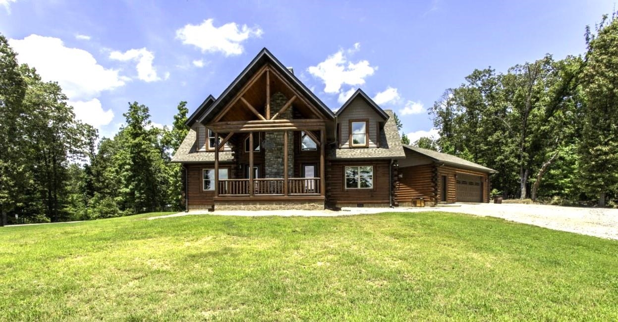This stunning custom-built log cabin was completed in 2022 and sits on 10 acres just minutes from Pocahontas, AR. With 2,257 square feet, this two-story home features 3 bedrooms, 2.5 bathrooms, and is constructed from solid white pine logs, offering rustic charm with high-end finishes. Inside, enjoy the warmth of white pine tongue-and-groove walls, a vaulted ceiling, and a dramatic stone fireplace in the living room. The open-concept kitchen is fully equipped with all appliances, quartz countertops, a center island, and a walk-in pantry ā perfect for home cooks or entertaining guests. Key Features: 3 Bedrooms | 2.5 Bathrooms | 2,257 Sq Ft White Pine Log Construction (Completed 2022) Vaulted Ceilings & Massive Stone Fireplace Central H/A| Built-in Backup Generator Fully Equipped Kitchen w/ Quartz Countertops Large Mudroom /Laundry Room Combo Oversized 32x24 Two-Car Garage (Tongue & Groove Interior) 30x30 Workshop with Power & Overhead Door Outdoor Patio w/stone fireplace & gas grill 10 Acres is partly wooded with Seasonal creek Located Just 5 miles from Pocahontas in Randolph County AR that is known for its 5 rivers that surround the county.