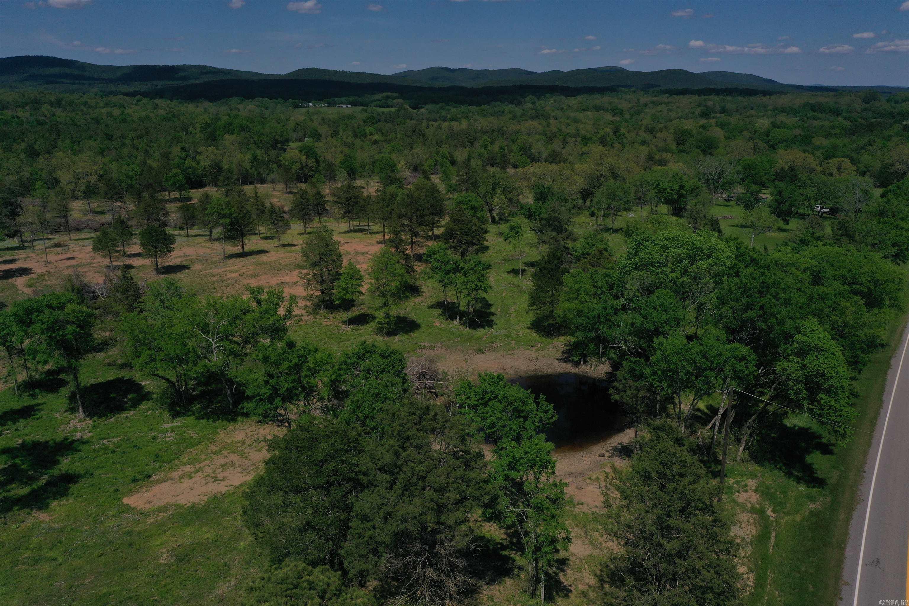 Located between Pencil Bluff and Lake Ouachita along highway 88, this 15 +/- acres perfect for a homestead or a weekend getaway! Montgomery County is home to Lake Ouachita, the Ouachita River, and the Ouachita National Forest, and this great tract is located within minutes of all three! Dragover Recreation area on the Ouachita River is just a few minutes’ drive down the county road, providing access to one of the most unique canoeing and fishing opportunities on the river. This section of the river offers a multiple hour float, that ends within walking distance of the parking area! The Ouachita National Forest is just minutes away as well, offering hundreds of thousands of acres of public land, with many great opportunities for hunting, fishing, hiking, and enjoying The Natural State. If you enjoy spending time on the lake, an access and boat ramp for Arkansas largest lake, Lake Ouachita, is just 15 minutes away. Whether you are looking to build, camp, or just have a place in the country to call your own, this tract offers a phenomenal location. Power is available at the road, and easily accessible for all build sites.