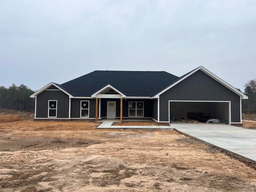 New Construction 4 bedroom 2 bath home on approx. 1 acre tract. Bryant schools but could do school of choice to other local schools. This new home features an entry way into the living area. Open living/kitchen/dining. Kitchen has beautiful custom cabinets with a large island. Pantry. As you walk in from the garage there is a locker/bench area. Laundry room. Primary bedroom is split from other rooms. Primary bathroom will have a stand alone soak tub and tile shower. Large closet. Two vanity areas. Electric fireplace with shiplap. Carpet in bedrooms and LVP throughout the rest of the home. Large two car garage. Concrete driveway. Large coved back porch across the back of the home. Don't miss out on this great home today!! **More pictures coming soon once painter is completed.
