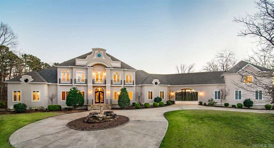 This French/European styled estate in the prestigious gated subdivision of Chenal Downs hosts a breathtaking entry with it's chandeliers, medallion inlay, and floating spiral staircase.  Its formal living, dining, and study are spectacular with abundance of trim work, rich paneling, and Brazilian cherry hardwood flooring, perfect for formal entertaining.  This home is perfect for outdoor entertaining as well with swimming pool, infinity hot tub, cascading stone waterfall, and expansive veranda.  A MUST SEE!