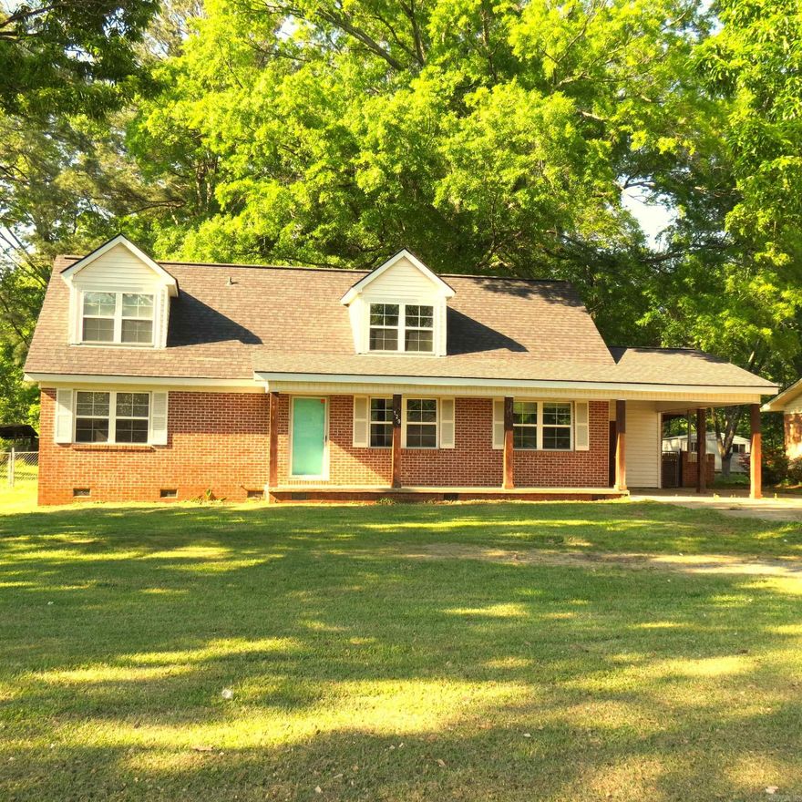 Cute home with so much potential!!  4 bedrooms, 2 bath home with fenced backyard.  2 bedrooms downstairs, 2 bedrooms upstairs.  This home has hardwood floors.  Upstairs the carpet has been removed and wood floor is ready to be refinished.  Home still needs some trim work, base boards etc.  These finishing touches will make this your new home.  Shop in back yard is wired for electricity, for a workshop or man cave.  Call today to make this your new home!!