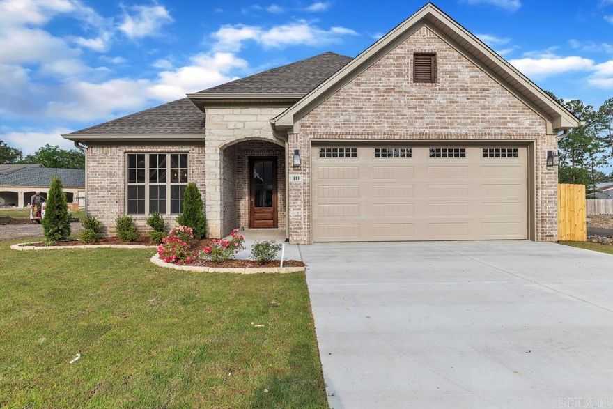 Welcome to your dream home in the heart of West Little Rock's prestigious Copper Run neighborhood! This immaculate 3-bedroom, 2-bathroom all-brick home exudes elegance and comfort from every corner. As you step inside, you'll be greeted by soaring vaulted ceilings and luxurious vinyl flooring that flows seamlessly throughout the home. The open-concept living area is bathed in natural light, creating a warm and inviting atmosphere perfect for both relaxation and entertaining. The gourmet kitchen is a chef's delight, featuring stunning quartz countertops, modern appliances, and ample cabinet space. Imagine preparing meals while gazing out at your fully fenced backyard, a private oasis backed up to serene green space, ensuring peace and privacy. Retreat to the spacious master suite, complete with a beautifully appointed en-suite bathroom. The additional two bedrooms are generously sized, offering comfort and flexibility for family, guests, or a home office. This home is equipped with stylish blinds and every detail has been meticulously maintained, making it move-in ready for the discerning buyer.