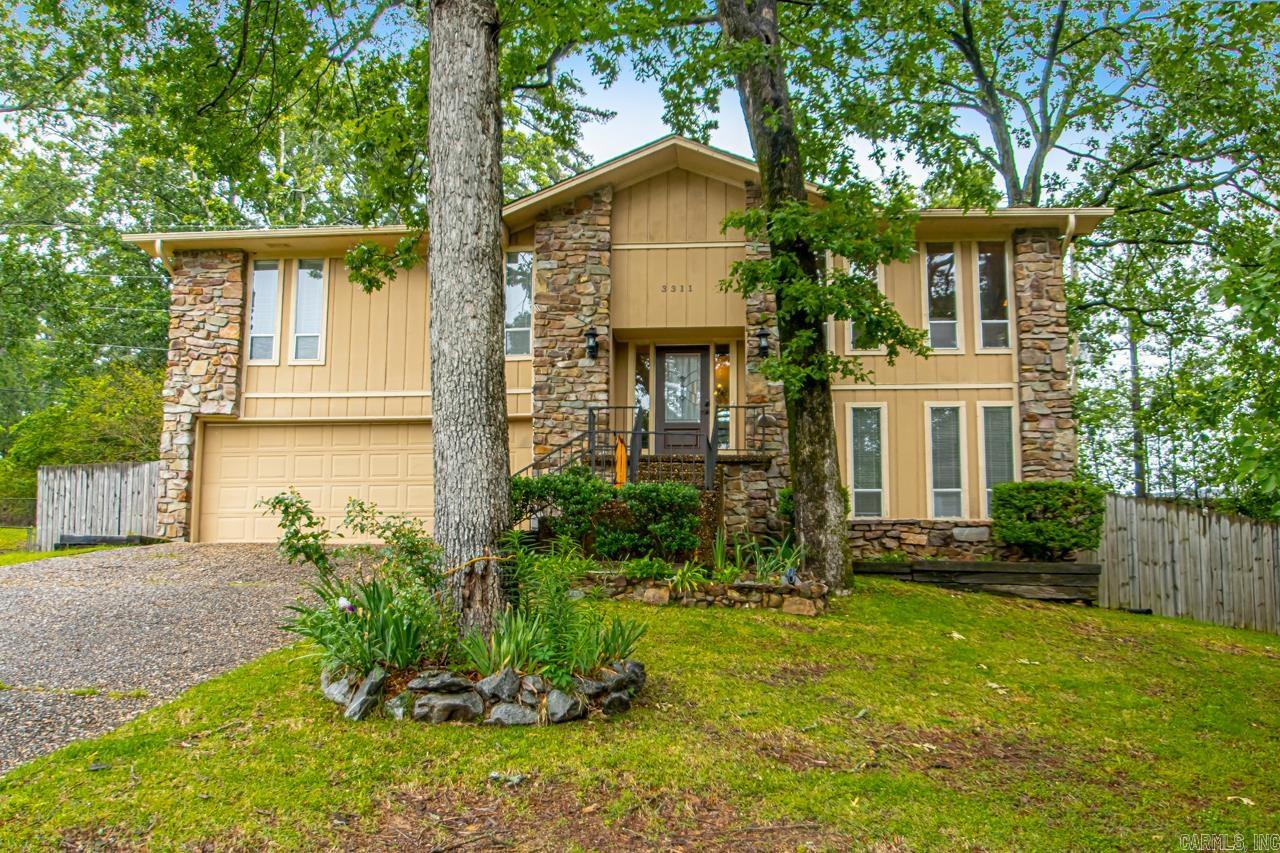 Welcome to beautiful 3311 Hazy Ridge Court! This home sits in a wonderful neighborhood in the culd-de-sac on a huge lot! There are so many awesome upgrades! You will notice the lovely details as soon as you walk in and up to the main floor. There is a large living space with big windows that opens up to the dining and kitchen area. Lots of natural sunlight! There are three good size bedrooms upstairs with two updated full baths. Downstairs you have an additional living area with rock gas log fireplace, bedroom, full bath and laundry area. There is a new deck, covered patio and fencing with extra concrete. Enjoy privacy in the back yard and a dreamy pergola with a swing. NO SHOWINGS MAY 18-23. Showings will resume on May 24.
