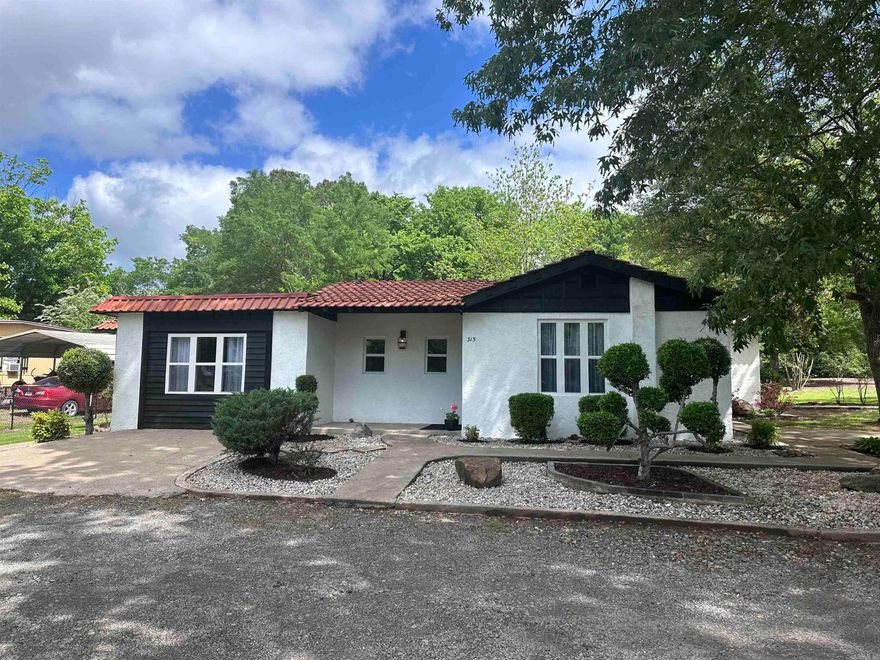 Charming Remodeled Spanish-Style Home with Modern Upgrades and Timeless Character.   Step into this beautifully remodeled Spanish-style gem, where classic charm meets modern comfort. This thoughtfully updated home features a brand-new kitchen with stylish finishes, fully renovated bathrooms, and all-new windows that fill the space with natural light. An expanded floor plan includes a spacious new dining room and a convenient laundry room, perfect for today's lifestyle. Enjoy the ease of a 1-car garage and relax in the landscaped yard surrounded by mature trees, offering both beauty and privacy. Whether you're entertaining or simply enjoying a quiet evening, the outdoor space and elegant interior details make this home truly special.  Don’t miss this rare opportunity to own a move-in ready Spanish-style retreat with all the modern updates!