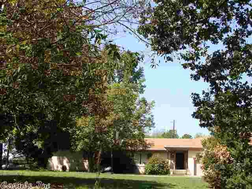 Home at end of country lane, offers seclusion & view of rolling hills! Lots of storage inside & out. Inside: formal dining, 2 living areas, basement/cellar & wood floors. Outside: 35x45 metal shop & other outbuildings. Property fenced & cross fenced for livestock & shares a pond. Has barn with stalls, chicken coop, garden area, old smoke house & 35x45 metal shop. Above ground pool & a well (both need repair). This is a Short Sale subject to third party approval. Price has not been approved by third party.