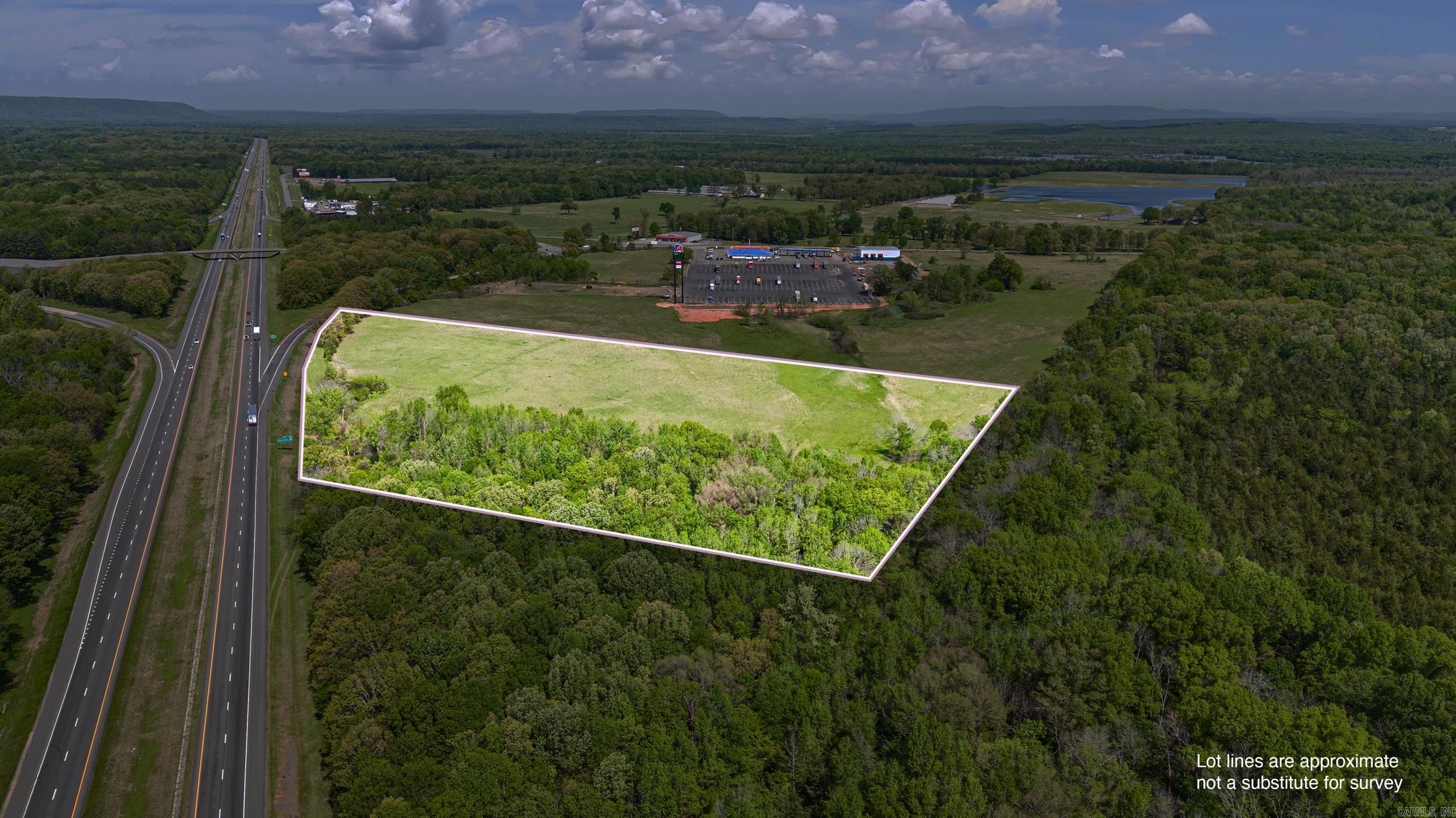 PRIME VACANT LAND – 15 Acres w/ Interstate Frontage | Atkins, AR Looking for land that checks all the boxes? This 15-acre, flat parcel is ready for development and packed with potential. Located right off the interstate and next to the newly remodeled TA Truck Stop, it’s a golden opportunity for your next big move. Endless Possibilities – Perfect for your vision—whether you’re thinking commercial, residential, recreational, or investment. High Visibility & Prime Location – Interstate frontage with consistent traffic flow Truck Stop Adjacent – Tap into an existing high-traffic hub Strategic Location – Easy access for travelers, truckers, and locals alike This one’s a rare find—don’t miss your opportunity to own a prime piece of acreage or commercial land located in Atkins, AR. Reach out today to walk the property!