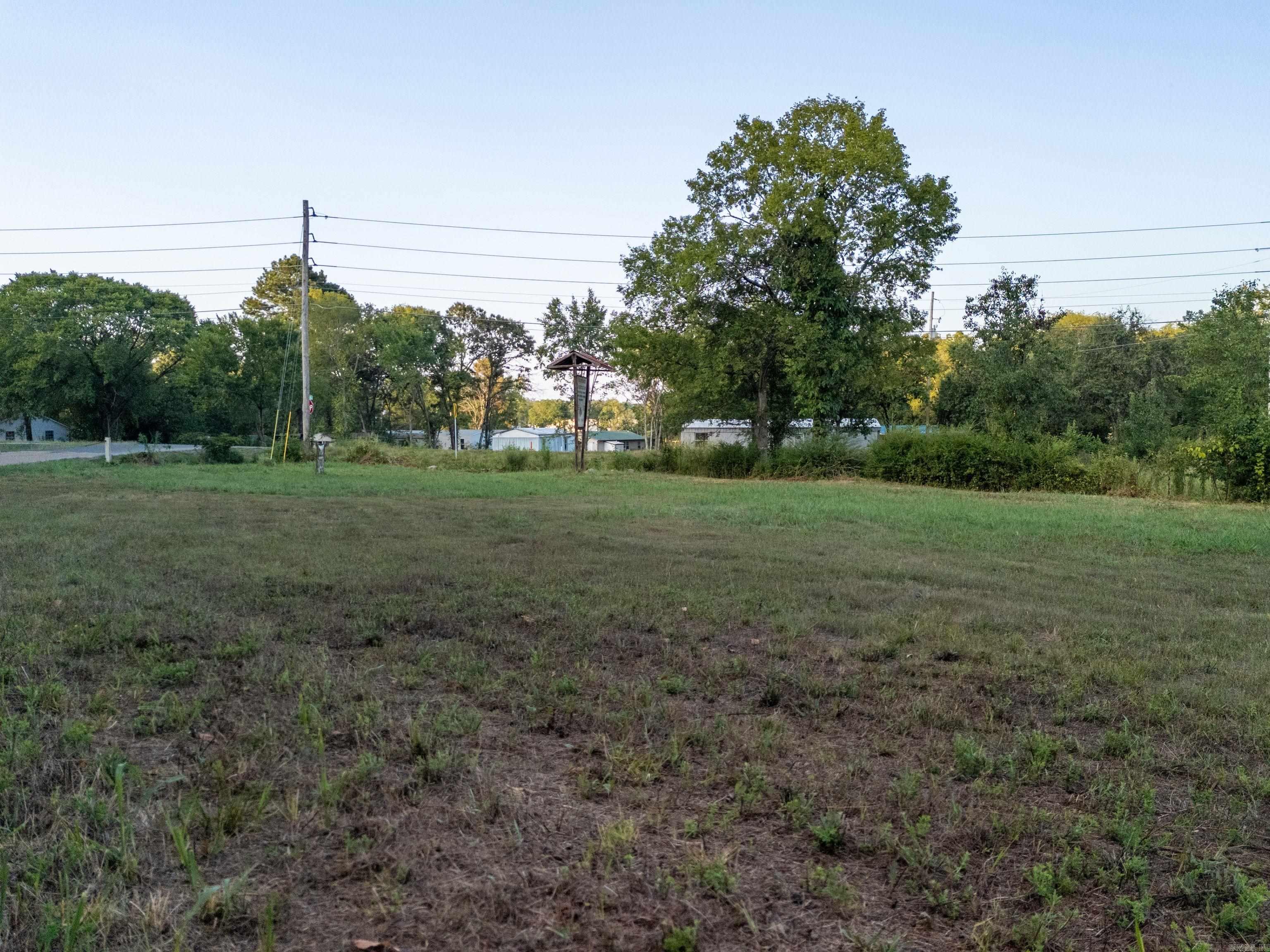 Endless Potential Awaits, Discover the beauty and tranquility of this remarkable parcel of land on Mountain Pine Road. Nestled in a peaceful, natural setting just minutes from Lake Hamilton, Lake Ouachita, and Hot Springs, this property offers the perfect blend of seclusion and convenience. Whether you're dreaming of building a private retreat, starting a small homestead, starting a business, or investing in future development, this land provides a blank canvas for your vision. Surrounded by mature trees and gently rolling terrain, the property offers multiple potential building sites, paved road frontage, and easy access to utilities. With the serene backdrop of the Ouachita Mountains and abundant wildlife nearby, you'll enjoy the quiet charm of rural living while still being close to schools, shopping, and recreation. Don't miss your chance to own a piece of Arkansas paradise.