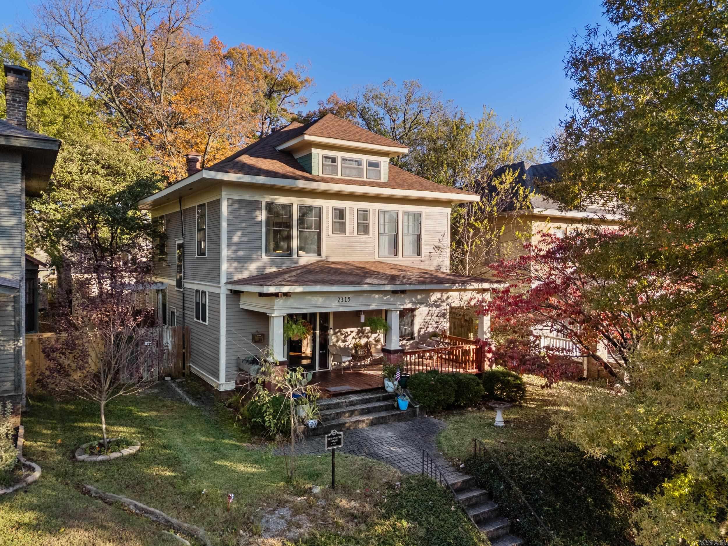 Welcome to the Vine-Couch House, a beautifully preserved and thoughtfully updated 1912 three-story home that seamlessly blends historic charm with modern amenities. This architectural gem features 3 spacious bedrooms, 3 full baths, and an office on the second floor. The bonus room is on the third floor, perfect for a home gym, playroom, or guest retreat. Step inside to discover the original hardwood flooring, intricate woodwork, and stunning pocket doors that showcase the craftsmanship of a bygone era. The gas fireplace in the living room offers a cozy centerpiece. The updated kitchen is a chef’s dream, equipped with an iconic AGA range, two sinks for convenience, wood countertops and ample space for entertaining. Enjoy meals in the dining room or take your coffee out to the large screened porch, overlooking the fully fenced backyard. Relax on the expansive front porch, perfect for unwinding or greeting neighbors in this charming community. Alley access leads to a detached one-car garage, adding functionality to this classic property. Don’t miss your chance to own a piece of history, enhanced for modern living. New roof/ext paint 2021, new upstairs HVAC 2022, new water heater 2023.