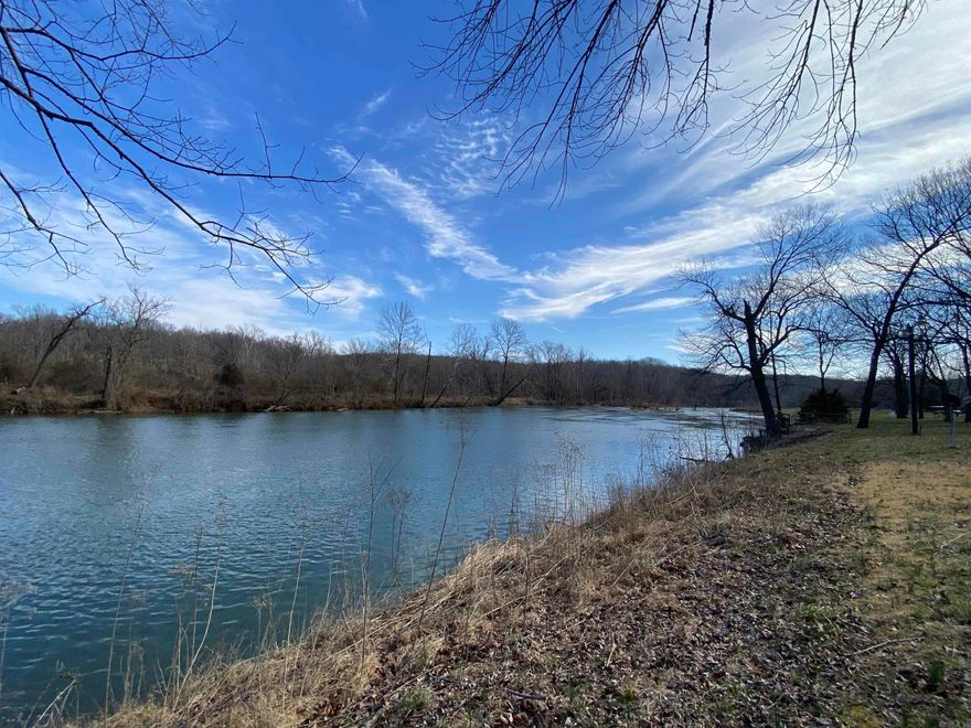 EMBRACE THE TRANQUILITY OF RIVERFRONT LIVING and build your own cabin on the serene banks of the Spring River. This remarkable property provides the canvas for your dream retreat, complete with a rare and essential feature: electricity is already in place, ensuring convenience and modern comfort as you design your riverside haven. The possibilities are endless w/this gem. Whether you envision a cozy weekend getaway, year-round residence, or an investment opportunity. With the river at your doorstep, fishing, kayaking, and simply enjoying the serenity of the water are just a step away. The allure of a cabin on Spring River w/existing electricity & breathtaking views is a rare find. Create the life you've always dreamed of. Make your vision a reality today, and let this property become your private retreat.