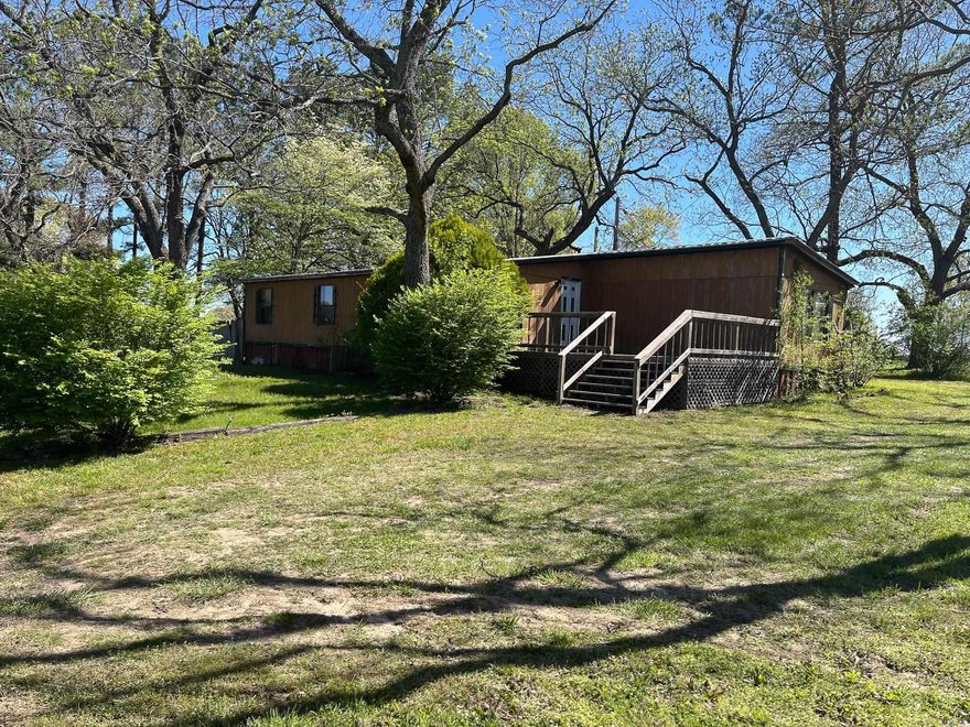 Discover peaceful country living in this 3BD 2BA mobile home just outside of Marshall. The home offers comfort and opportunity, with a spacious bonus room that expands your living space and adds versatility to the layout. The home is fully livable but could use some TLC to truly shine. Perfect for a handyman special, weekend project, or investment property.   The home sits on a well-kept 1-acre lot that has been newly surveyed with a nice open yard that is perfect for outdoor gatherings and starting a garden.   This home is a fantastic opportunity for someone to add their personal touch. Please Note: This property is being sold AS IS WHERE IS, giving the buyer a chance to make it their own without seller repairs. Don't miss this great opportunity! Call today!