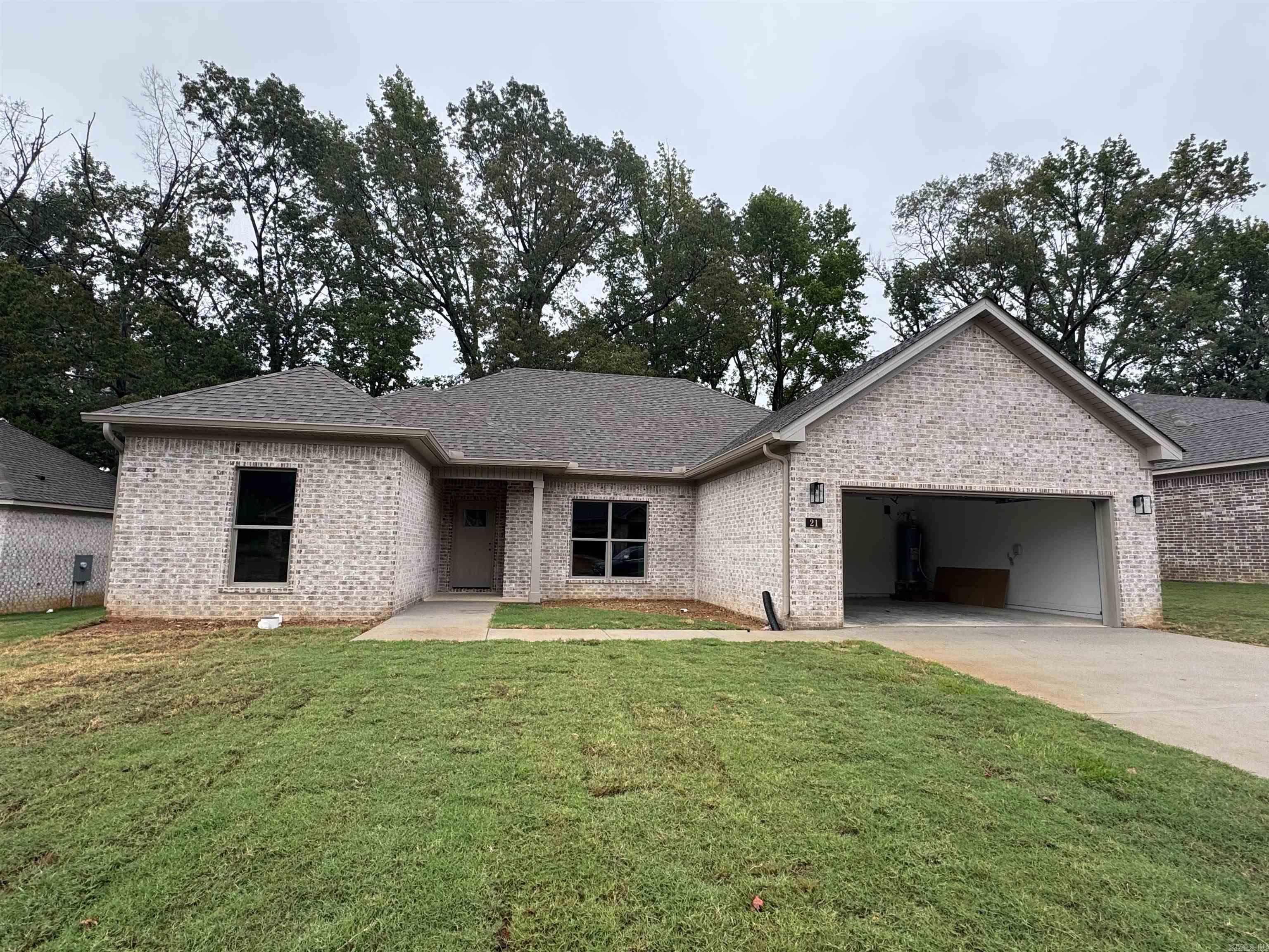Welcome to Carmel Oaks, one of Cabot's newest communities, only 12 miles from the Little Rock Air Force Base. This NEW construction floor plan offers 3-bedrooms and 2-bathrooms. As you enter, youāre greeted by tall ceilings, a cozy fireplace, crown molding, and an open floor plan that seamlessly connects the living, dining, and kitchen areas. The MASSIVE living area features natural light and a seamless flow into the designated dining area with a great view of the covered back patio! This home utilizes SOLAR board roof decking for energy efficiency. Other features include: floored attic space for ample storage, 42" custom kitchen cabinet upgrades, granite countertops, custom kitchen pantry with a receptacle for your coffee station, LVP flooring, tiled shower in the master bathroom, comfort height toilets, large custom walk-in master closet, 50 gallon water heater, recessed lighting AND ceiling fans, elegant finishes and neutral tones to enhance versatility. This property is also equipped with an irrigation system. Located in highly sought after Cabot School District. Several new-homes and floor plans to choose from! (Photos may not show exact finishes of this address.)