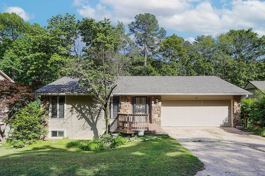 A nice family home tucked away on a quiet street in Leawood. Three bedrooms and two newly remodeled bathrooms, plus bonus room with ample storage downstairs (perfect for a playroom or den). Large dining room on main level opens to spacious kitchen with breakfast area. Den with pretty stone fireplace leads to paneled sunroom offering additional living space.  Upstairs and downstairs decks offer room to enjoy the outdoors and overlook the large backyard that backs up to a creek. A really pretty setting! Two car garage. New roof and newly installed carpet in all bedrooms.