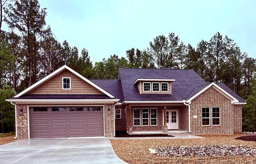 Escape to Beautiful Hot Springs Village, Arkansas!  3 Bed | 2.5 Bath | Level Lot | Open Floor Plan  Step into comfort and convenience in this stunning home located minutes from the east gate of Hot Springs Village, the nation’s largest gated community filled with lakes, golf courses, and scenic mountain views.  Property Features:  3 spacious bedrooms and 2.5 modern bathrooms  Light filled open floor plan with entertaining kitchen  Oversized pantry  Ensuite bath with soaker tub and oversized tile shower  Large walk-through laundry room leading directly into the primary walk-in closet  Generously sized closets in every bedroom  Desirable level lot with easy access  Expansive covered patio — ideal for relaxing evenings or outdoor gatherings.  7'8" x 5'8" Heated and cooled storage area off of garage.  This home checks every box for functional and stylish living, all nestled in a quiet, wooded setting. Whether you're looking for a forever home or the perfect retirement spot, this one won’t last long!  Schedule your private tour today and experience what life in Hot Springs Village is all about!