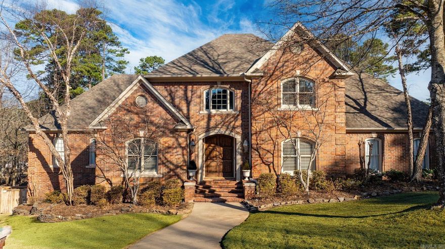 Welcome to this stunning builder’s custom home in the LaMarche Subdivision of Chenal. This 4-bed, 4-bath residence offers over 4,500 SF of thoughtfully designed living space, situated on an expansive corner lot. Step inside to soaring ceilings, plantation shutters, and 3 fireplaces, creating warmth and charm throughout. The primary suite on the main level features a cozy fireplace, an ensuite with a large soaking tub, separate shower, and dual walk-in closets. An additional office space could easily convert into a fifth bedroom.The chef’s kitchen is a dream, boasting a Sub-Zero refrigerator, double ovens, gas cooktop, granite countertops, walk-in pantry, and ice maker. The spacious great room includes another fireplace, while the screened porch with cedar accents invites relaxation with its own fireplace and step down to a deck with hot tub.Outdoors enjoy composite decking, extensive professional landscaping, and a large walk-in crawlspace for additional storage. With 3 HVAC units, ceiling fans throughout, 3 car side load garage and abundant attic storage this home is as functional as it is beautiful.Washer and dryer convey for added convenience.See Agent Remarks