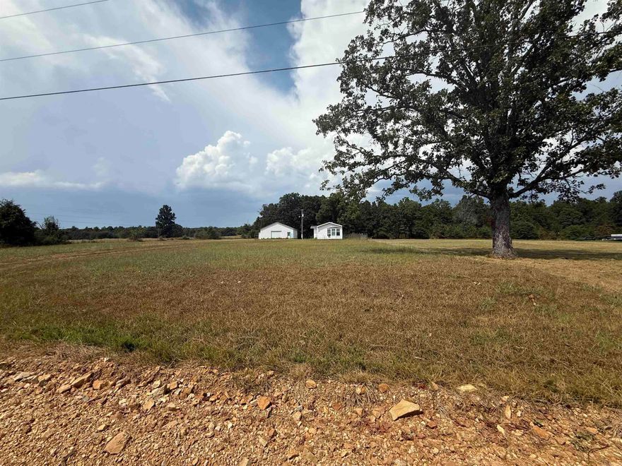 COUNTRY HOME Enjoy peaceful country living on this level 2.5-acre property featuring a 1,216 sq ft manufactured home with 3 bedrooms and 2 baths. One bathroom includes a garden tub and walk-in shower, offering comfort and function. The home has been vacant for some time and will likely need updates and care before move-in, but it provides a solid foundation for someone eager to create their own country retreat. Outside, a 30x40 shop building with a concrete floor gives you space for projects, storage, or a hobby business. The property also includes a drilled well and septic system, along with plenty of room for gardening, raising a few animals, or simply enjoying the open land and fresh Ozarks air.  Located near Mammoth Spring, Arkansas, this property is just a short drive to the world-famous Mammoth Spring State Park, home to one of the largest natural springs in the U.S. The park offers trout fishing, kayaking, hiking trails, and the historic Frisco Depot Museum. The Spring River, well known for its crystal-clear waters and year-round floating, is easily accessible in the area, giving you endless opportunities for recreation. Local conveniences like dining, shopping, and schools
