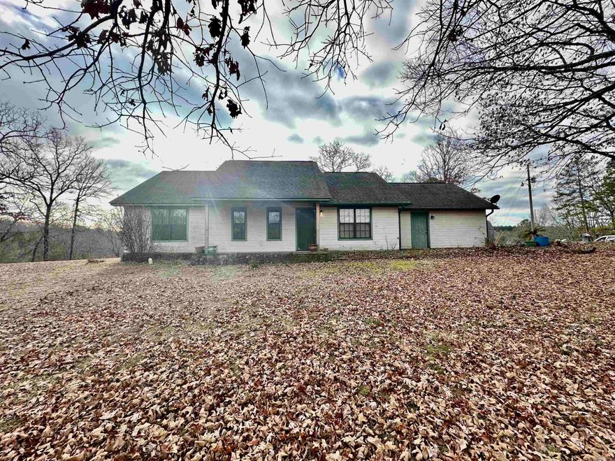 Quaint 3 bed, 2 bath home nestled on 5 acres in Dover, AR. This 1320 sq ft residence offers a perfect blend of comfort and space.  Enjoy the inground pool with a covered lounge area perfect for relaxation and entertainment. A highlight is the 40x50 shop, insulated, plumbed, and equipped with LED lights, ideal for any hobbyist or storage needs. Experience the tranquility of country living and while enjoying modern amenities. Just minutes from National Forest and Forest Service Recreational Areas. Your dream home awaits!