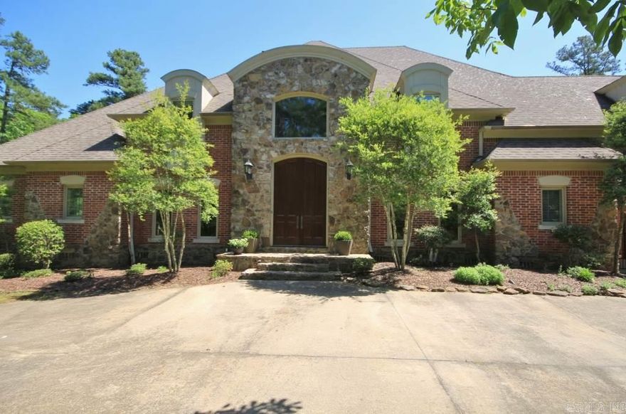 Stately Brick Home on 5 Wooded Acres. Two Story Foyer Opens to Beautiful Staircase Leading to Open Living Room/Dining Room w/Beautiful Trimwork, wall of Windows and Stone Flooring. Master on Main Level with Fireplace, Large Bath and Two Walk In Closets with an Adjoining Office Space. 3 Car Attached Garage and 2 Car Detached. Sparking Pool with Large Deck, Covered Patio Space. 3 BR/2.5 Baths on Second Floor with Huge Media Room with FP and Wet Bar. Playroom on 3rd Level.  Great Opportunity for Area!