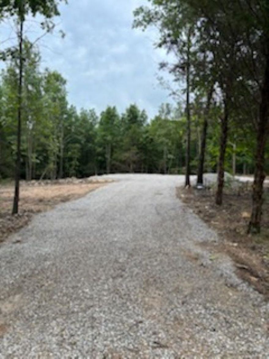 Great location just off hwy 412 at Highland in the foothills of the Ozarks. Just a few miles from Spring River and to area schools. The drive into it is private and maintained by the property owners which makes it private but not remote. The current owner has had a gravel pad and some clearing done! It has electricity on the property and city water is just across the private drive! Own a part of the famous Hardy area today!
