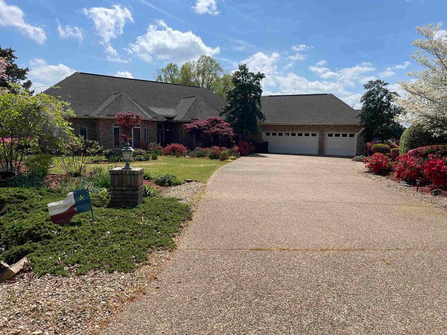 With 242 feet of stone seawall a true level point lot with panoramic views on Lake Balboa this is rare find.  This gem boast Southern Exposure which is highly coveted for providing year -round natural light.  Enjoy the sunsets from the your back porch or private dock featuring two boat slips with lifts, ideal for pontoon and fishing boat.  This One-Level Home specifically designed for accessibility with no stairs, wide hallways and level transitions from the circular driveway to interior and out to the Lake.  This home offers maximum privacy by placing the Primary Suite on one side and the guest wing on the opposite side.  The two guest bedrooms are connected by a functional Jack and Jill bath, allowing each their own privacy.  The oversized Laundry room acts as a secondary "service hub" featuring built-ins and utility sink.  the Three-car garage with Extra Space:  fully finished with built-in cabinetry and workbench.  A modern, open concept and dining combination features a curved breakfast bar, purposely designed to facilitate face to face conversation during meals. An oversized office for remote professional work or hobby space has His and Her built-ins on both sides.