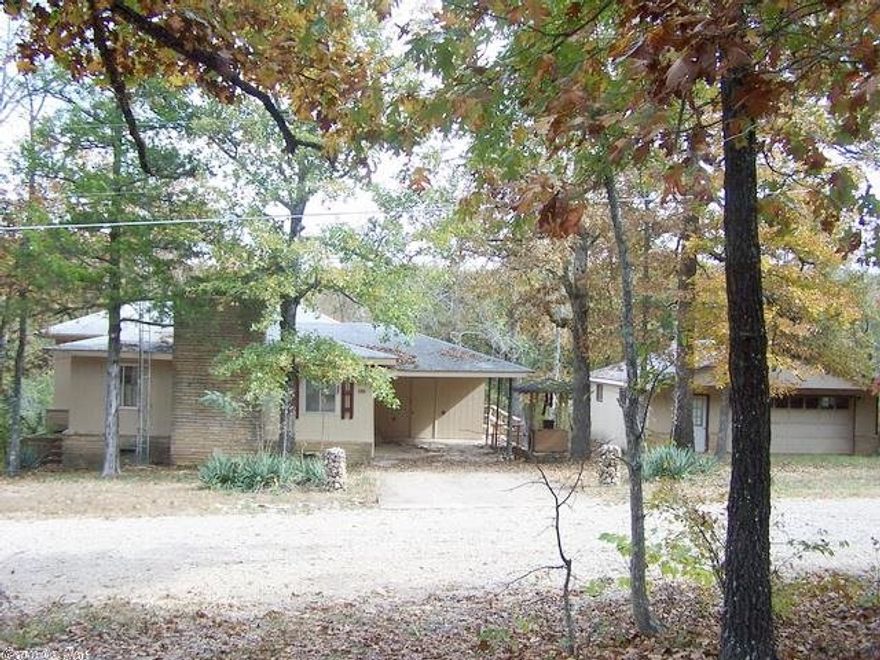 Open floor plan, real wood peg wood floors. Walkout basement with bathroom. Attached carport and detached garage. Country setting only minutes to Lake Norfork access. Large open deck.