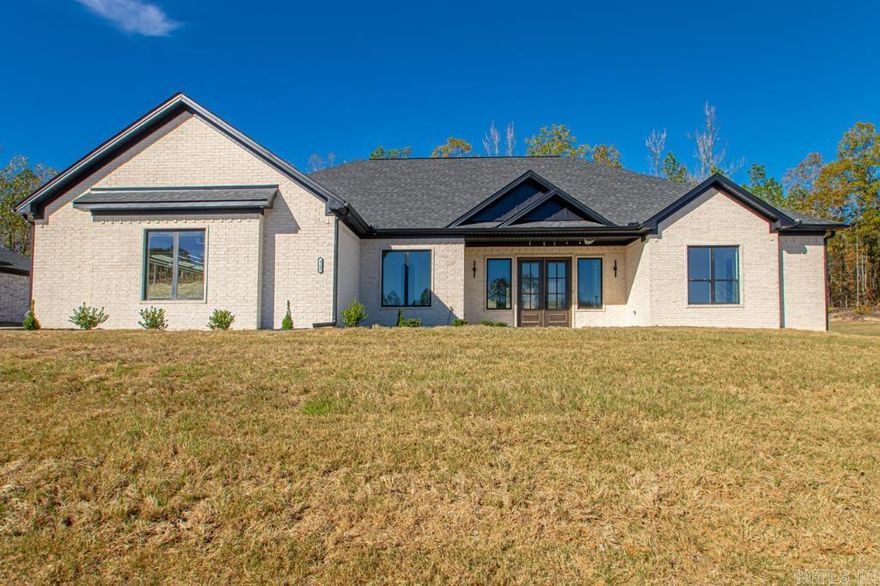 This immaculate home features an open floor plan and is enhanced by a striking brick fireplace. Main living area welcomes you with a high cathedral ceiling. The stylish kitchen features stainless steel appliances, quartz and granite combo countertops, and a large walk in pantry. The oversized primary suite, is accompanied by 3 other  bedrooms with 3 more bathrooms. The master primary suite, has access to the laundry room. This house also has a very deep 3 car garage, and covered large patio.