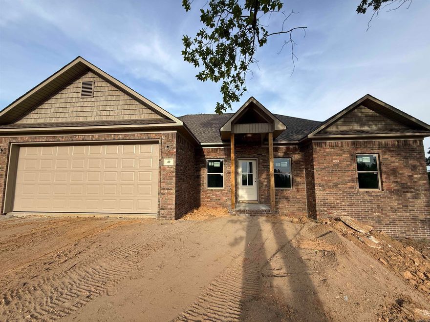 Welcome to this beautiful new construction home set on a private, wooded lot offering peace, space, and endless potential. The thoughtfully designed layout features an open-concept living area with soaring ceilings, creating a bright and airy feel throughout the main living space. Large windows and a central rear door bring in natural light and provide views of the expansive backyard, perfect for future outdoor living or entertaining. The home includes a spacious attached garage and a well-planned floor design that seamlessly connects the living, dining, and kitchen areas—ideal for modern living. Interior framing and drywall are already in place, giving you a clear vision of the generous room sizes and flow. Situated on a sizable lot surrounded by mature trees, this property offers privacy while still providing plenty of usable yard space for recreation or gardening. Don’t miss your chance to own a brand-new home in a serene setting!