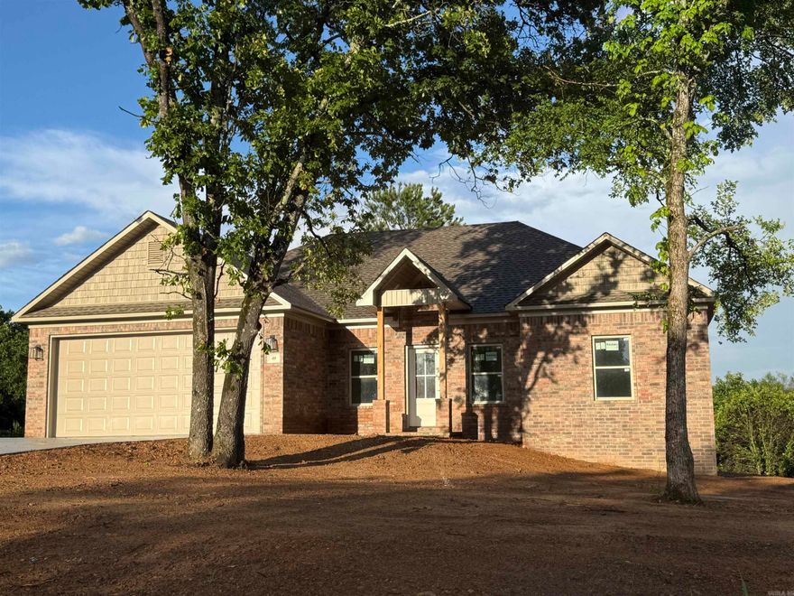 Welcome to this beautiful new construction home set on a private, wooded lot offering peace, space, and endless potential. The thoughtfully designed layout features an open-concept living area with soaring ceilings, creating a bright and airy feel throughout the main living space. Large windows and a central rear door bring in natural light and provide views of the expansive backyard, perfect for future outdoor living or entertaining. The home includes a spacious attached garage and a well-planned floor design that seamlessly connects the living, dining, and kitchen areas—ideal for modern living. Interior framing and drywall are already in place, giving you a clear vision of the generous room sizes and flow. Situated on a sizable lot surrounded by mature trees, this property offers privacy while still providing plenty of usable yard space for recreation or gardening. Don’t miss your chance to own a brand-new home in a serene setting!