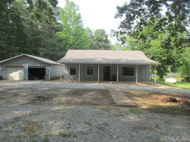 Discover your perfect escape at this rural property spanning 91 acres of natural beauty. This well maintained home has 3 bedroom 1 1/2 bath home. Fenced backyard, storage buildings, detached garage. Featuring 2 ponds and flourishing mature timber and pine. Call today for your personal tour.