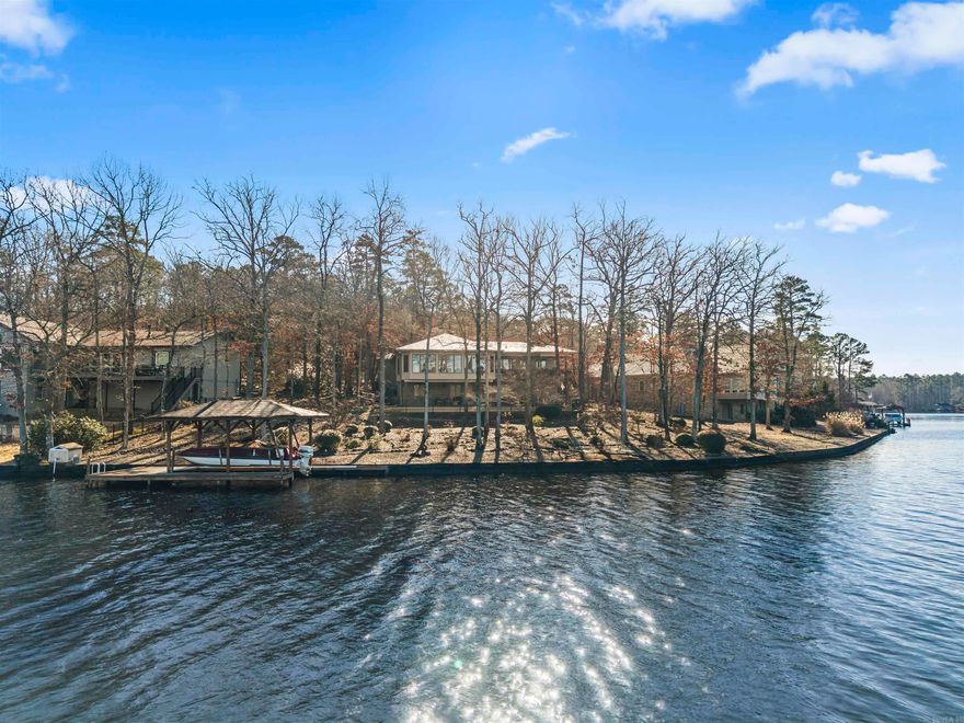 PREMIUM Lake Coronado WATERFRONT with 155' Seawall! Covered Boat Dock w/Hoist on this 380 acre Lake! (2nd largest HSV water skiable lake). This ONE OWNER home boasts PANORAMIC 180+ degree views on the Point! On the Main Floor of this 4114 sq ft Home, you'll find Gorgeous LVP Flooring, a Cathedral Ceiling in the Living Room w/Brick Gas Fireplace, Formal Dining Room w/Bay Window, Granite Kitchen w/Smooth-top Range (Island will stay), Big Laundry Room w/Wash Basin, Desk and Pantry with Fold-out Organizers! Continuing on the Main Floor is the AMAZING Sun Room (approx. 15x29!) with 180 degree View over the Lake! The Primary Bedroom w/Inlayed Ceiling and Ensuite w/Walk-In Closet, opens to the Deck with View as well! The Lower Level has a Full Bath, Massive Storage Room, 3 Bedrooms, Living Area, and Office with Additional Storage! Walk-out to the Patio and Iron-fenced Backyard (perfect for furry family members). Irrigation from the lake (free water usage) serves the landscaping. There is additional room on the side of the 2 Car Garage for a 3rd Bay to be added! The curved driveway leads to this Beautiful Home on nearly 3/4 Acre Lot!
