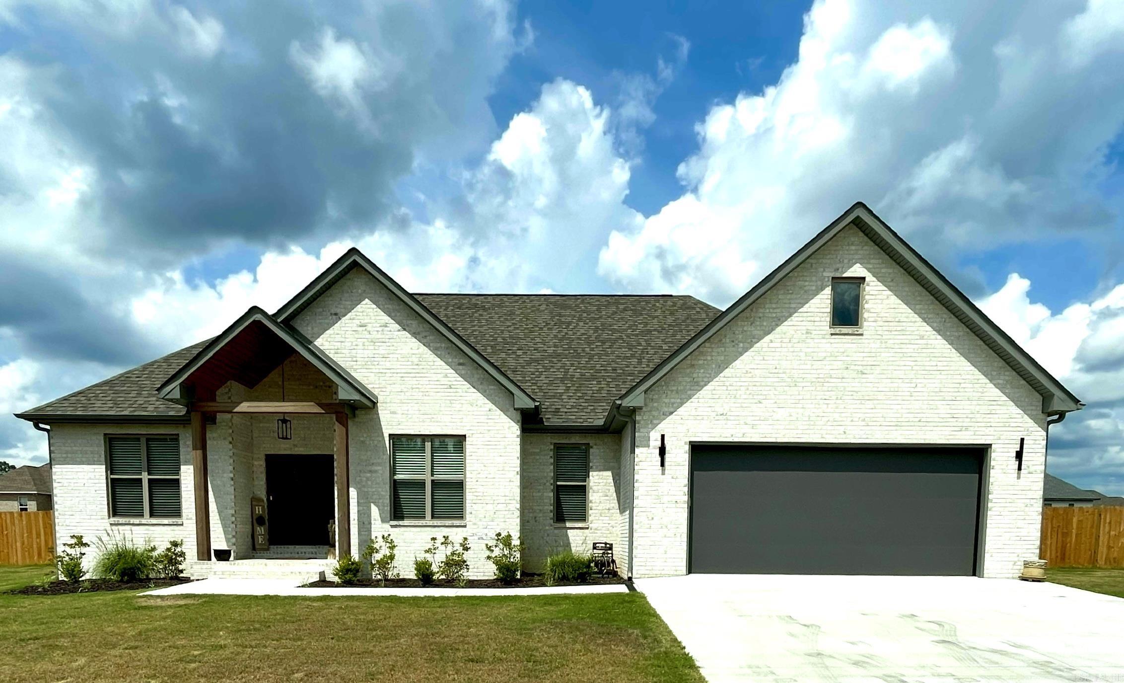 4/2 NEW BUILD LESS THAN 1 YEAR OLD IN DESIRABLE JACOB CREEK SUBDIVISION WITH BUILDER'S WARRANTY IN EFFECT THROUGH 02/27/26. This fully fenced all brick home sits on 0.36 of an acre and has an oversized 2 car garage with storage room. Inside the home, the great room boasts 10' ceilings and is open to the kitchen and dining area while overlooking the covered outdoor patio with retractable sun shades. The quartz countertops flow into the amazing laundry room filled with built in storage and folding area. The primary bedroom is spacious with a luxury primary bath with spa like atmosphere featuring both a soaking tub and oversized walk in shower, as well as his and hers walk-in closets. Back outside, the driveway will hold an additional 4-6 vehicles while the privacy fence with 12 foot gate provides easy access for your toys. The game day porch has room for both seating and dining as well as a designated grilling area. WELCOME HOME to 125 Allie Jo Lane. You're going to love it here!