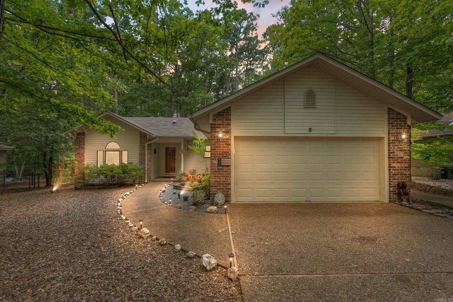 NEW LISTING! This charming one-level home is move-in ready, offering a five-year Platinum Home Warranty. The spacious kitchen features a new farmhouse sink and faucet, ample countertop and cabinet space, and an open concept with an eat-in breakfast bar, perfect for the family chef. The open floor plan is ideal for gatherings, and the large bonus room off the dining area is bathed in natural light, great for hobbies and crafts. The private master suite includes a bath with new vinyl flooring, a walk-in shower, dual vanities, two walk-in closets, a linen closet, and a makeup counter. Guest bedrooms and a bath with new vinyl flooring are on the opposite side of the house, providing privacy. The third bedroom, with an armoire, also makes a great home office. The two-car heated garage has a workbench, shelving, and pegboards. The long side driveway is perfect for a golf cart and trailer and leads to a tool shed in the large backyard, which features mature trees for shade and privacy. This home is just five minutes from the Coronado Center, Woodlands Auditorium, POA, hiking trails, golf courses, pickleball and tennis courts, and lakes!