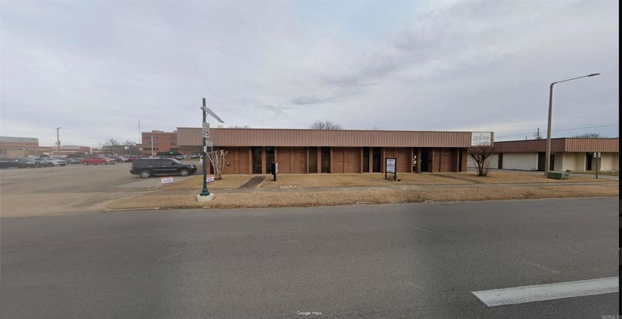 15 office spaces, 1 conference room, 2 kitchen areas, 5 bathrooms. Approximately 12 parking spaces.