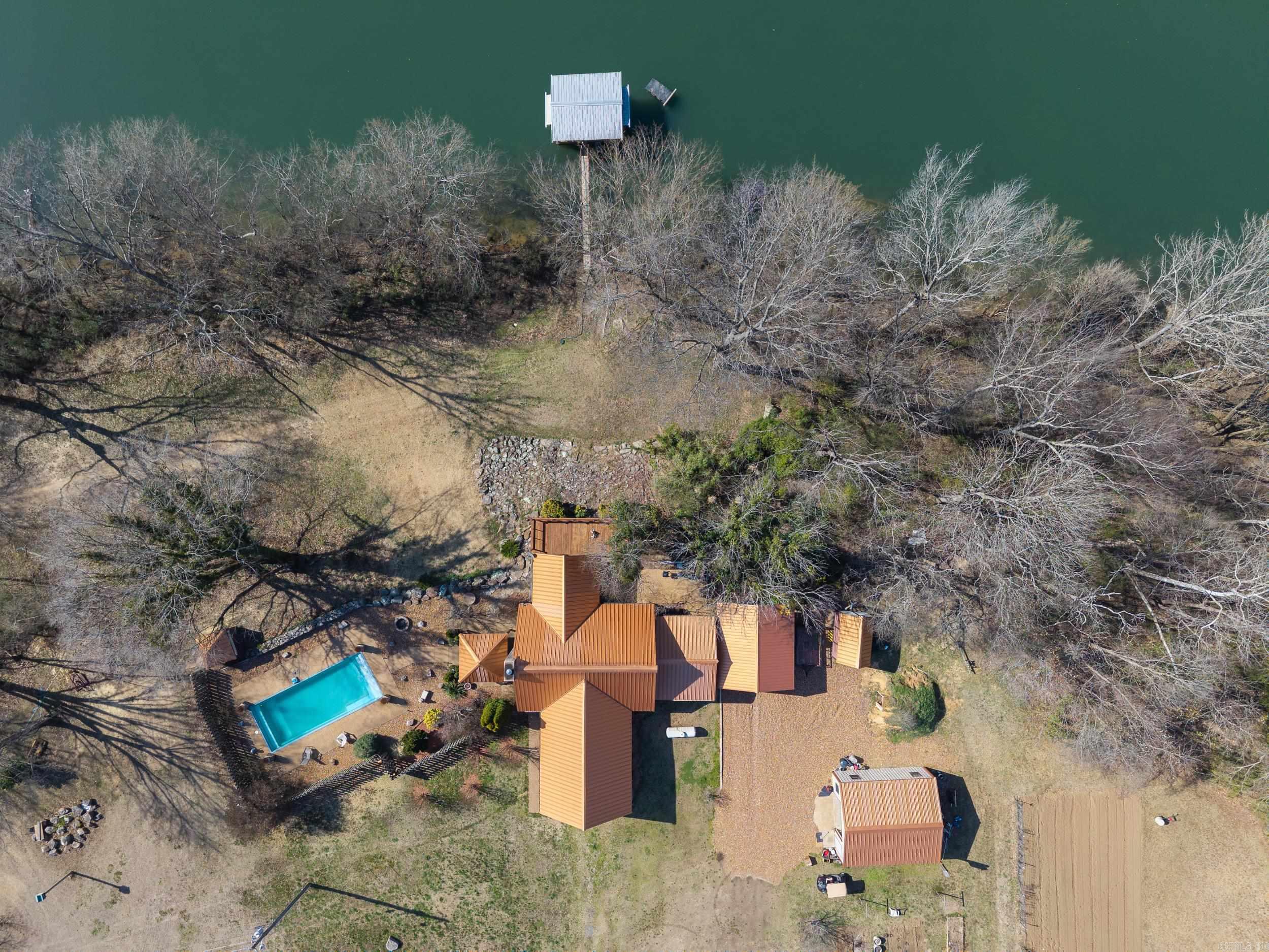 This beautiful Riverfront property is one of a kind! 7 acres no flood zone. Includes an inground pool, shop, greenhouse, and covered boat dock. This home is a true representation of Riverside Living! Come see it for yourself.