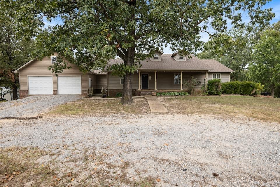 This spacious 3,702 square foot home combines modern updates with the peace of country living. Featuring 5 bedrooms and 3 bathrooms, the layout includes 3 bedrooms upstairs and 2 downstairs, sunroom, perfect for families, guests, or multi-generational living. The finished basement is a standout, complete with its own kitchen, living area, wood burning fireplace, and private entrance that is ideal for a mother-in-law suite, or guest retreat. Inside, enjoy fresh neutral paint throughout, generous living areas, a well-equipped main kitchen, newer stainless appliances, and abundant of storage. Major updates provide confidence and value, including a roof just 2 years old, brand-new guttering, and HVAC (outside) unit only 3 years old. An oversized double garage with stairs leading to overhead storage adds even more practicality and space. Outside, the property shines with 4.5 acres of mature trees and land for gardening, recreation, or animals, along with a private pond perfect for fishing or simply relaxing. Move-in ready with flexible living space, modern updates, and room to grow. Recent appraisal and inspection have been completed, schedule your showing today!