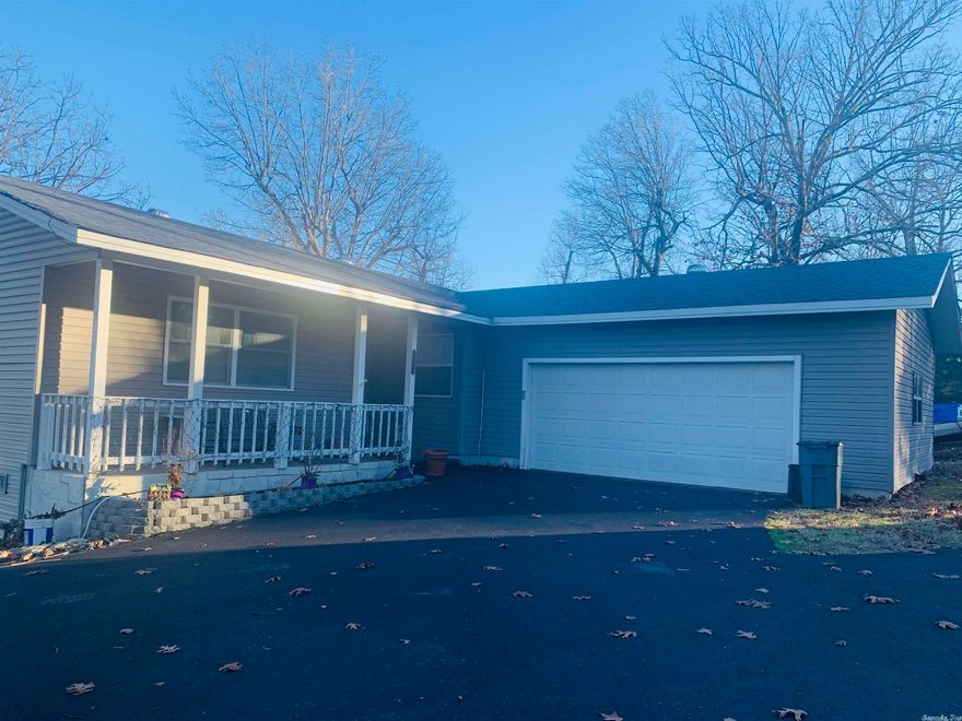 All about the view!!! Beautiful newly renovated home on 4 lots with breathtaking year-round lake views, adjoining the Corp, just minutes from a boat launch & all the amenities of Mountain Home! This 3 bedroom 2 1/2 bath home has updated bathrooms, new paint, new HVAC, new deck, new roof & newly paved circle drive. Cozy & charming, as it is, the 2 back decks with views are where you'll want to stay! The lower deck even has a new enclosable gazebo for outdoor living with privacy & for cooler nights. Walk-out basement, 2 sunrooms facing the water, large master bath, 2 car garage with workshop area, RV parking w/hookup, private septic & well, storage building. Nice neighborhood! Call with questions or to view.