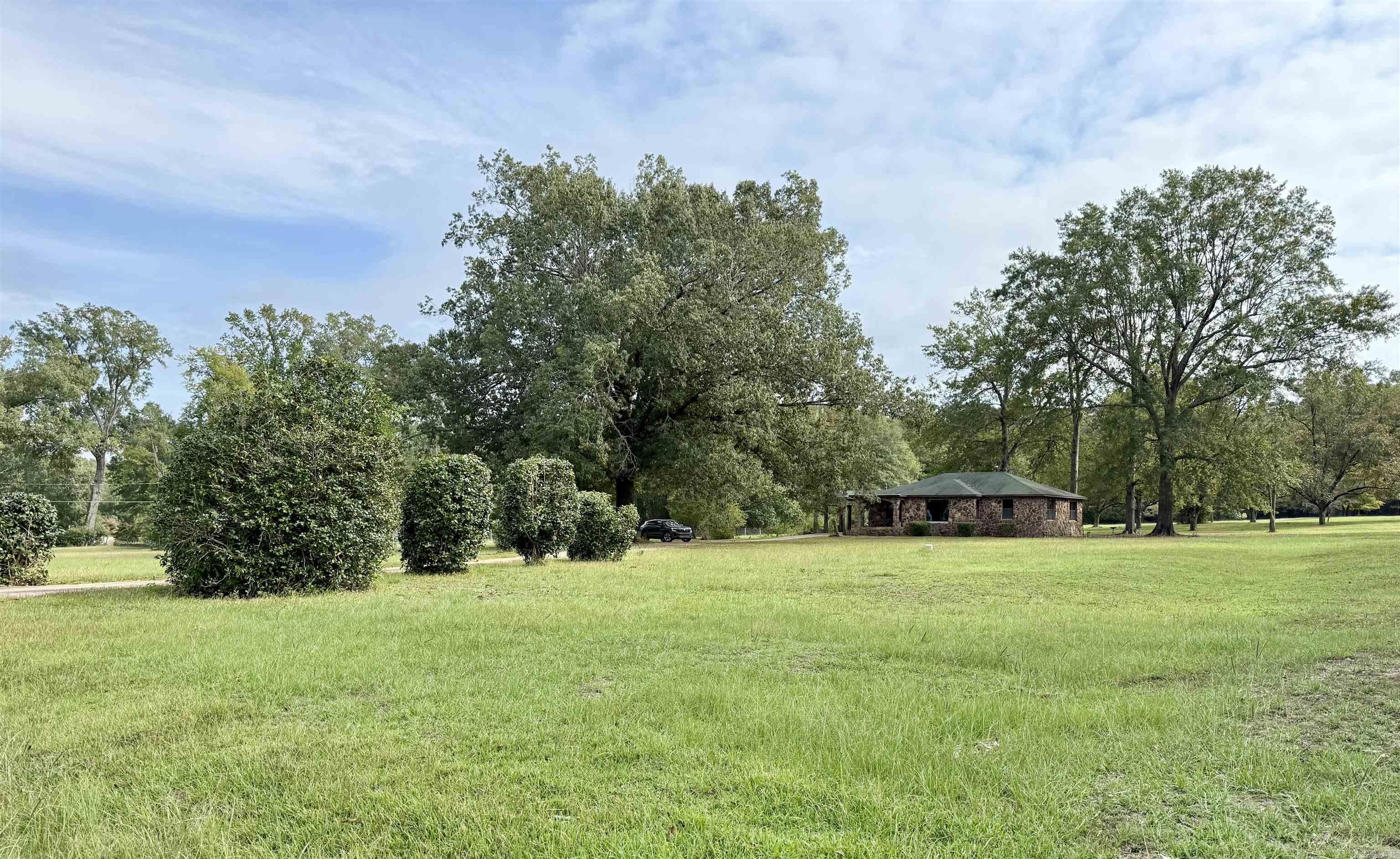 This charming 3-bedroom, 2-bath rock home sits on 5 beautiful acres at the end of a quiet dead-end street, offering the peace of the country with the convenience of being inside city limits. Recently painted living, dining, and bedrooms, with refinished hardwood floors that shine, the home features a spacious living room with a large window allowing for plenty of natural light, a cozy den area, and a functional kitchen ready for a personal touch. With great location, neutral colors, and endless potential for transformation, this property is priced under $100 per square footāan excellent value for such a desirable area surrounded by nature.