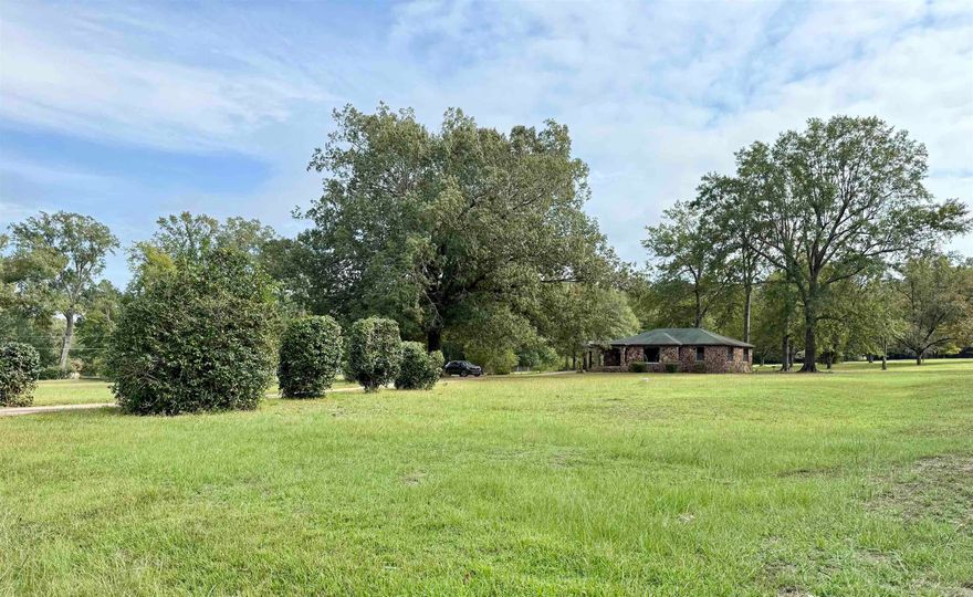 This charming 3-bedroom, 2-bath rock home sits on 5 beautiful acres at the end of a quiet dead-end street, offering the peace of the country with the convenience of being inside city limits. Recently painted living, dining, and bedrooms, with refinished hardwood floors that shine, the home features a spacious living room with a large window allowing for plenty of natural light, a cozy den area, and a functional kitchen ready for a personal touch. With great location, neutral colors, and endless potential for transformation, this property is priced under $100 per square foot—an excellent value for such a desirable area surrounded by nature.
