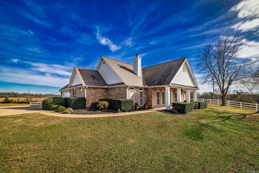 If you’ve been searching for a well-maintained home on acreage in the Bismarck area, this property checks all the boxes. Built in 2001 and lovingly cared for, this 3-bedroom, 2-bath home offers the perfect blend of comfort, functionality, and peaceful country living on 52.61 beautiful acres. Designed with accessibility in mind, the home is completely handicap accessible, making it ideal for buyers looking for long-term comfort without sacrificing style. Inside, you’ll find hardwood floors, a spacious and inviting layout, and a vaulted ceiling in the living room that creates an open, airy feel. The living space is anchored by a wood-burning fireplace and beautiful built-in cabinetry, adding warmth and character while offering practical storage. The primary suite is a true retreat, featuring a large walk-in shower, a relaxing seating area, and plenty of space to unwind at the end of the day. Two additional bedrooms provide flexibility for guests, family, or a home office. The guest bathroom includes a jacuzzi tub, perfect for soaking and relaxing. Step outside to enjoy the covered patio with a remote-controlled awning, ideal for entertaining, morning coffee, or just peace and quiet.