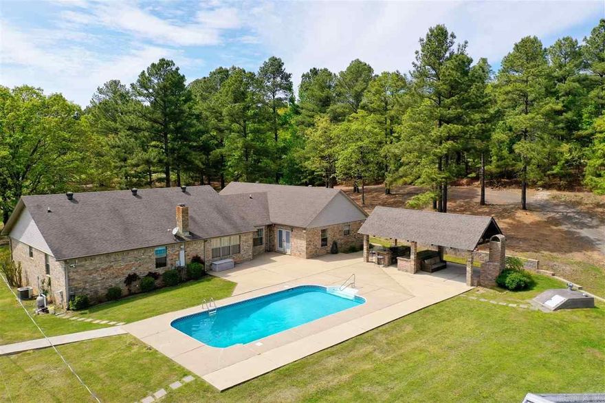 Beautiful 5 bed 2 bath home sitting on 4.1 acres. Perfect for entertaining with the outdoor kitchen and in ground pool. Has a big 3 bay shop on back of property.