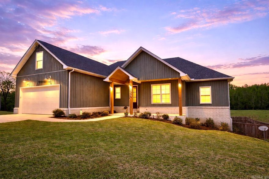 Built in 2023! 5th Bedroom option! Easy access to both Saline County & Little Rock! Abundant storage! —This three year old home is perfectly positioned on nearly an acre at the end of a quiet cul-de-sac. Step inside to an open-concept layout filled with natural light, warm wood accents, and thoughtful design throughout. The kitchen is a true centerpiece, featuring quartz countertops, custom cabinetry, floating shelves, and a spacious island that flows effortlessly into the living area with a cozy wood-burning fireplace. Primary suite designed for comfort & convenience, features oversized walk-in closet with direct access to the laundry room. Large upstairs bonus space/ 5th bed option with its own half bath offers flexibility for a media room, home office, or private guest retreat. The neighboring pond provides a serene backdrop for watching deer and wildlife right from your own covered porch. The fully fenced backyard offers both privacy and space to relax, play, or entertain. With abundant storage, modern finishes, and a setting that feels tucked away while still being convenient, this home delivers the best of comfort, style, and scenery.
