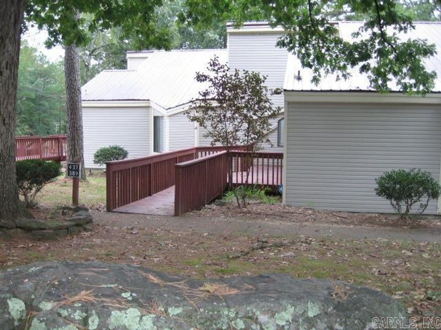 A BLANK CANVAS FOR YOU TO RENOVATE THIS LARGE CONDO!!  Everything has been removed, walls and floors with KILZ applied, then painted.  Also basic repairs are done.  So roll up your sleeves to finish as you desire.  Selling AS IS.  NO Seller Disclosure will be provided.   This unit has 2 bedrooms and 2 baths.  An extra 10 x 25' Sunroom is heated & cooled, with nice windows.  New refrigerator and New water heater in 2022.  It is 1 level for living space, but a basement for shop or storage.  You will love updating this low-maintenance unit that is so convenient to all the amenities to enjoy in Fairfield Bay.  It would be great for full time living, a weekend getaway, or a vacation rental. Call to see it today.